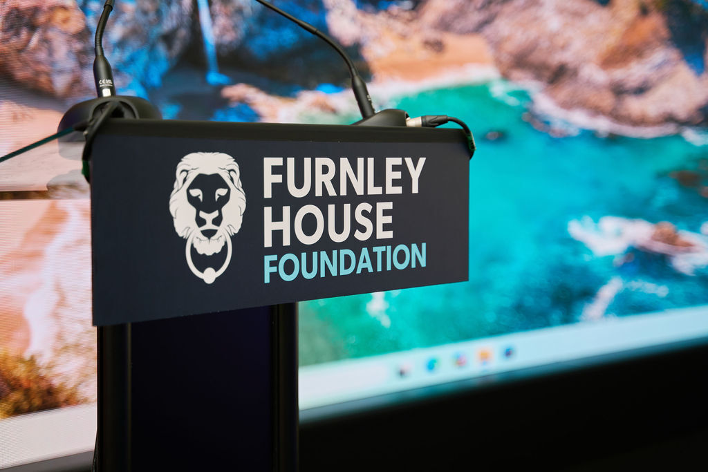 A charity being presented with a cheque